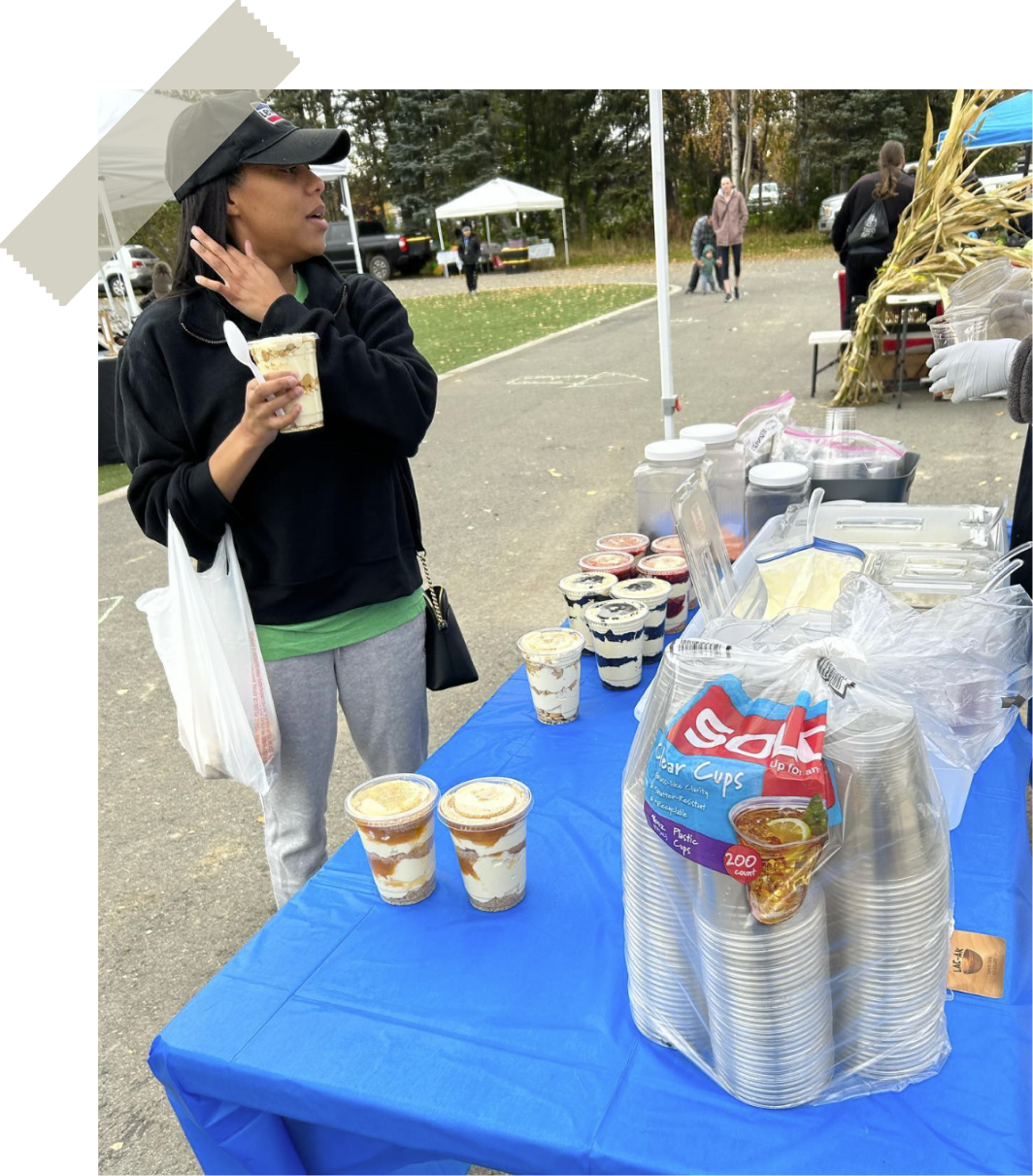 Guest enjoying a pudding parfait at a C&D market table